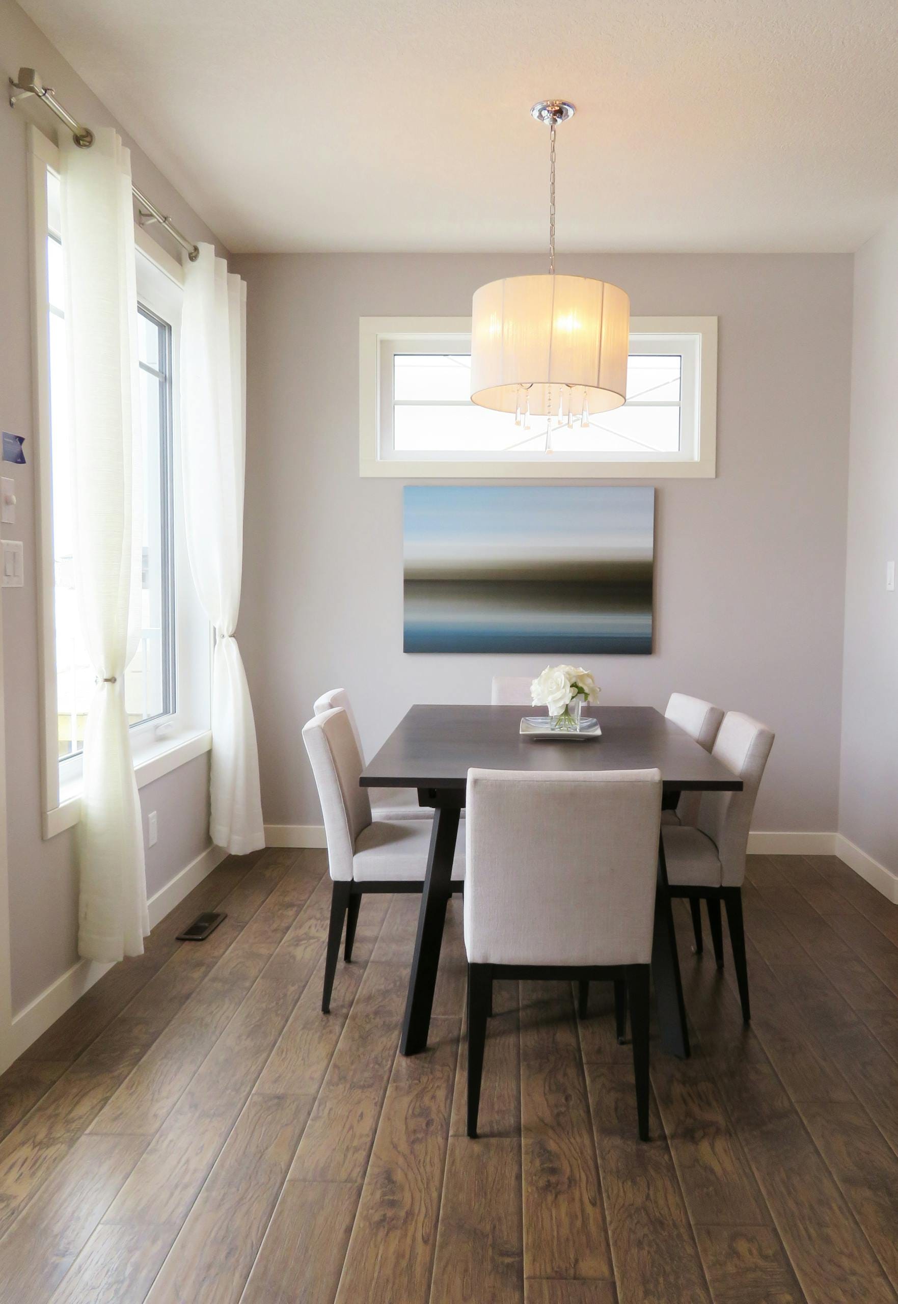 Brown Wooden Dining Table With Beige Pendant Lamp