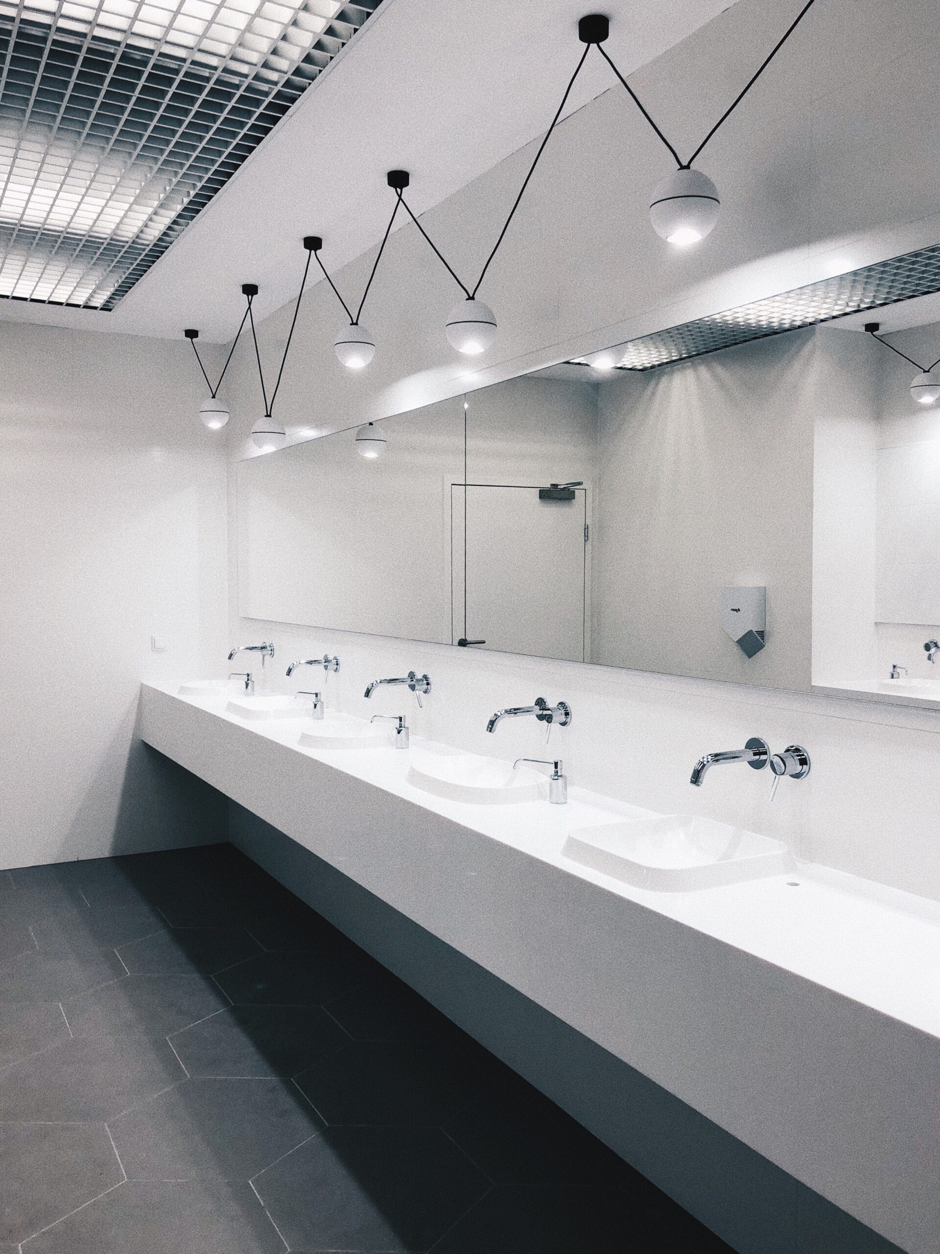 Business washrooms in Calgary after tile floor restoration